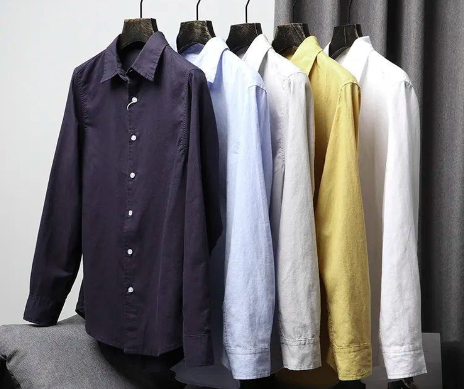 Men’s formal and casual shirts hanging on rack in different colors