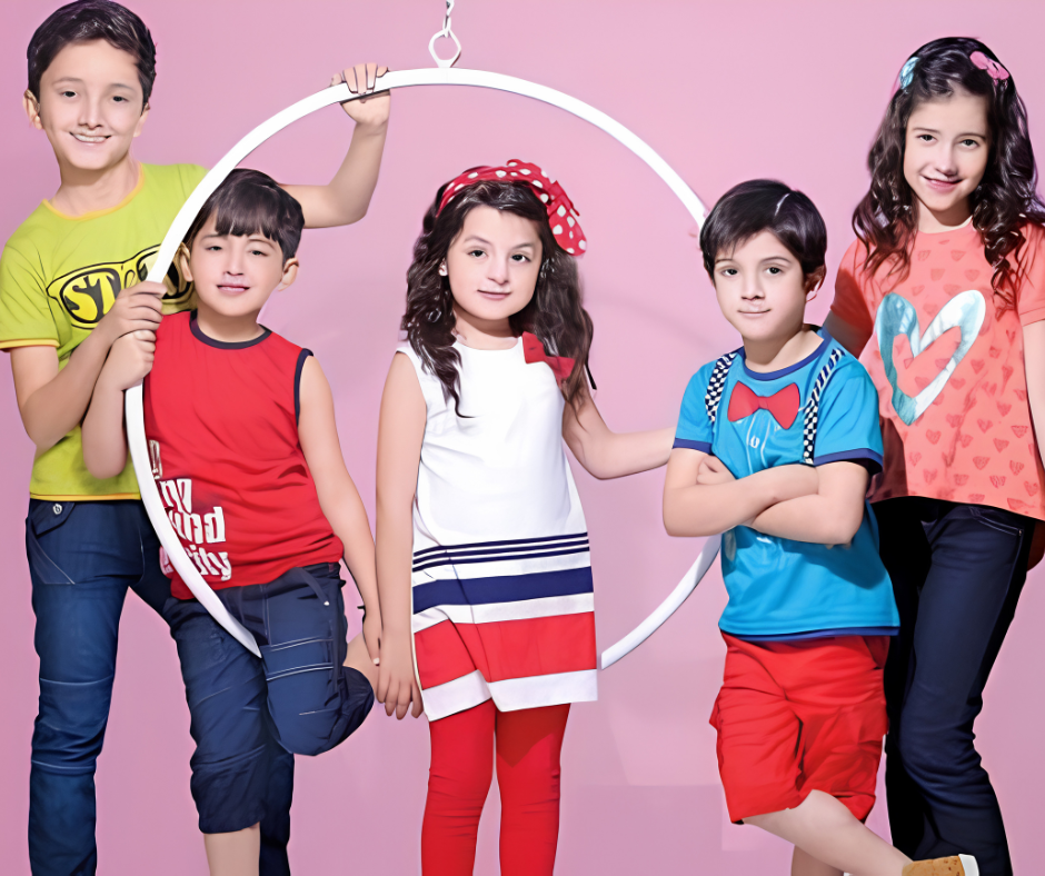 Group of kids wearing colorful casual outfits posing together in playful studio setting